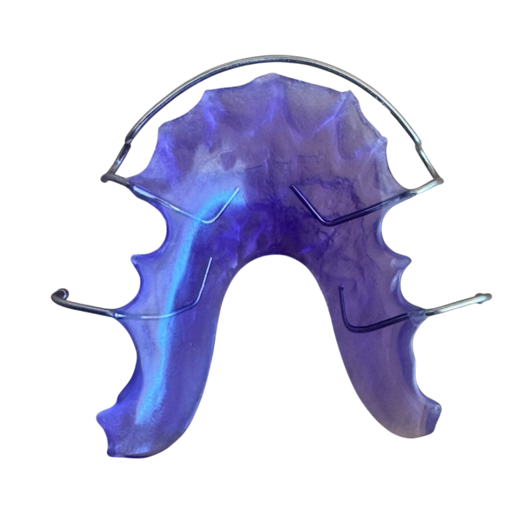 Purple dental retainer on a white background