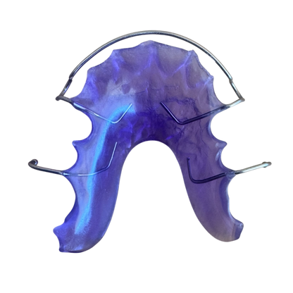 Purple dental retainer on a white background