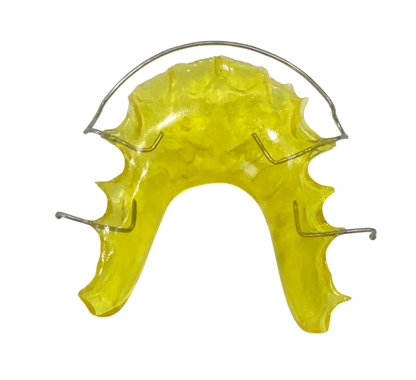 Yellow mouthguard with metal framework on a white background